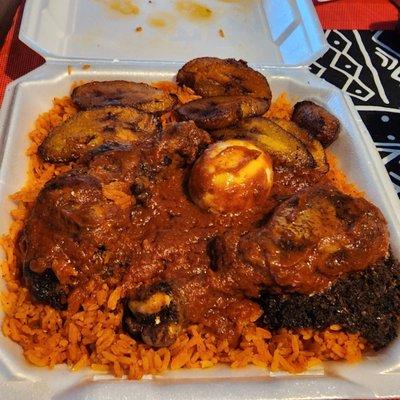 Jollof Rice with Chicken and Plantains. The black stuff is to make it spicy