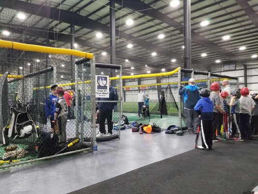 Plenty of batting cages surrounded by soccer fields