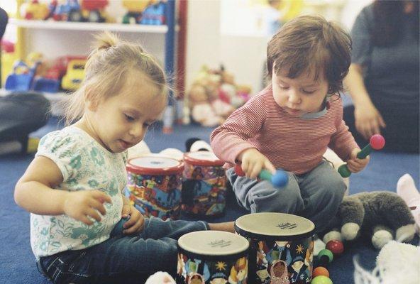 Toddlers play music & drums at Poppyseed Pre-Nursery