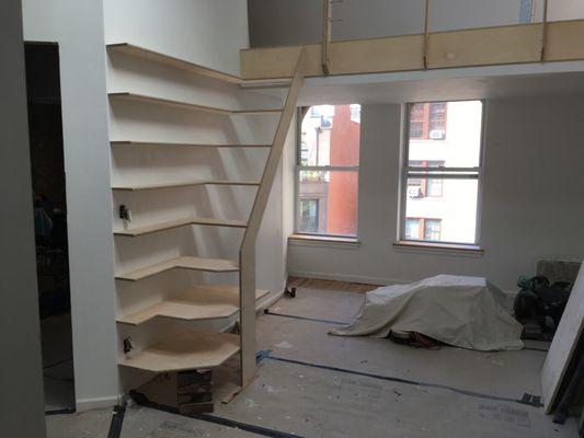 Sculptural staircase and shelves