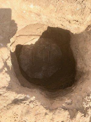 The concrete lid 2.5' down, covering the second of the two septic tank openings