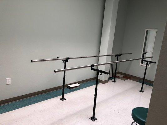 Parallel bars in one of the patient care rooms help patients walk with their new prosthesis.