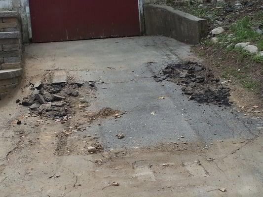 Driveway damage from dumpster pick up.