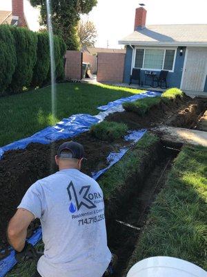 Richey Korkis digging the trench to replace the Main Water Line.