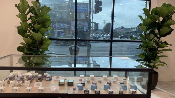 Product displays and exterior view of Greenwolf Cannabis Dispensary South LA