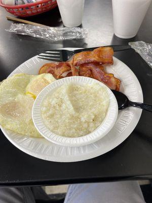 Eggs over easy, grits, bacon