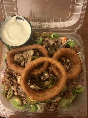 Steak salad. Added fried mushrooms and jalapeños. Blue cheese dressing.