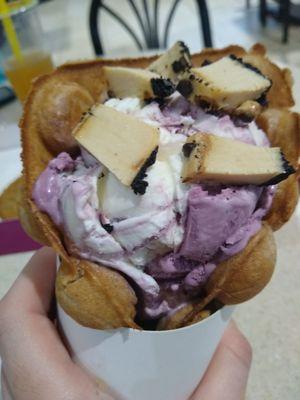 Bubble Waffle Cone with blueberry cream ice cream and cheesecake.