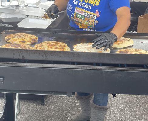 Pupusas on the flat top.