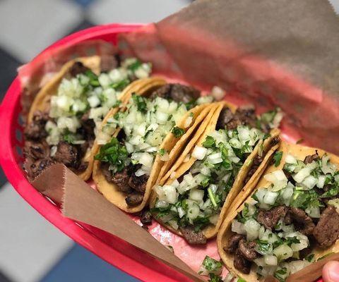 Mini Tacos come with limes, your choice of meat, onions and cilantro