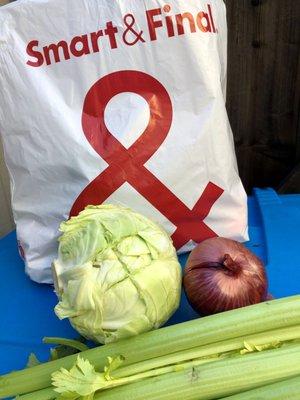 Cabbage with cut marks.  Produce delivered in a Smart & Final bag.