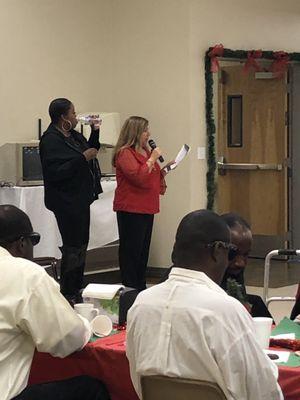 Sandy,the director, reading the story of Silent Night to the students at their Christmas luncheon. Just beautiful!