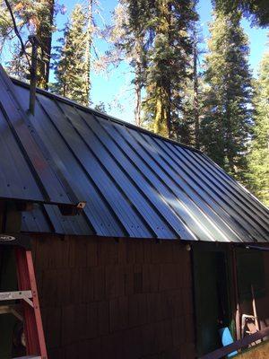 Metal roof completed on a cabin.