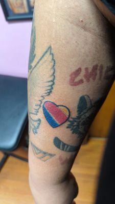 The Heart tattoo was done by Fess