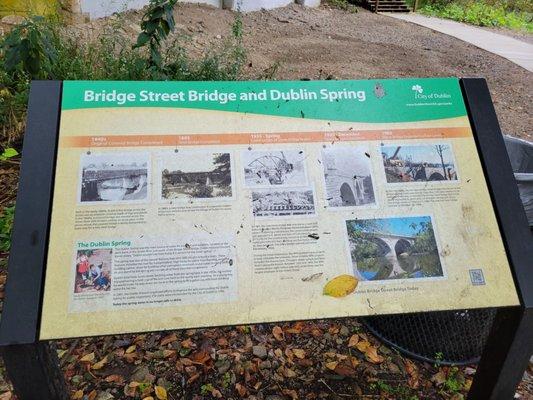 Signage about the bridge and spring