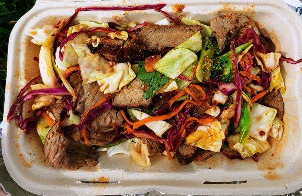 Yum Nue-- BBQ Beef thin, with chocolate, lemon juice, onion, carrot, cabbage over romaine.