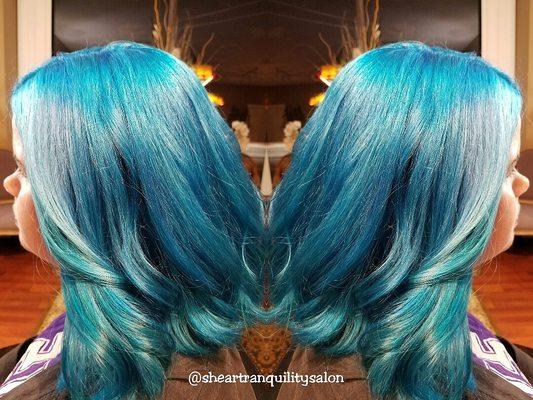 It was a 9 hour color correction using Olaplex. Took her hair from Ariel Little Mermaid red with regrowth to blue.