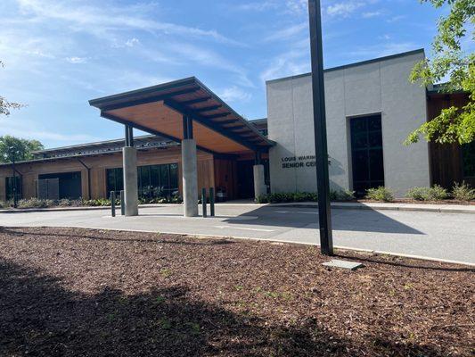 Main entrance with covered drive. There is ample parking.