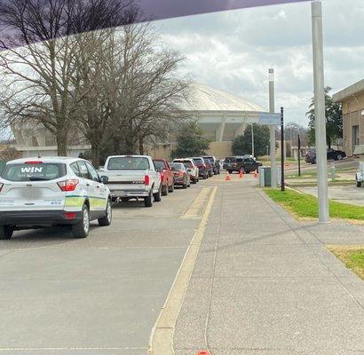 Cars driving in to Pipkin Building (on right) for Drive Thru Vaccinations