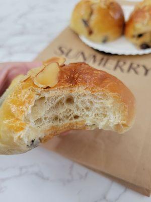 Raisin rolls - mixed with raisins and topped with almond slices