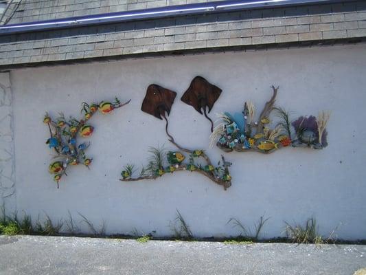 Rather interesting art work on the back (south) wall, outside.