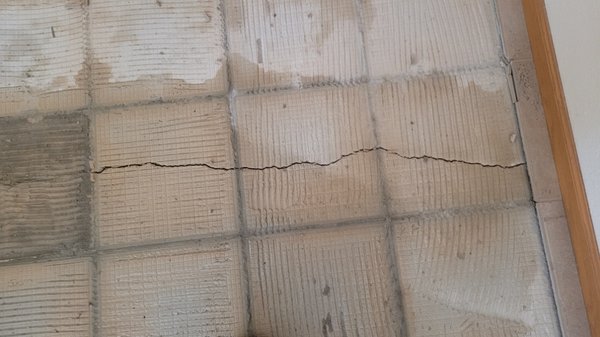 Cracking concrete under a tile floor