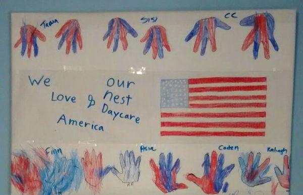 Our month bulletin board.  We love America and Our Nest Daycare.