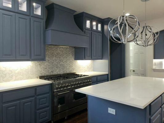 Kitchen remodel with custom cabinets and design, Quartz countertops, Marble backsplash, and professional grade appliances.