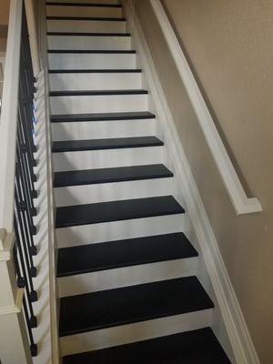 Carpet converted to wood stairs. Risers , steps and handrails painted