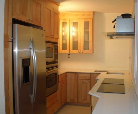 I used 2 double burner stove tops  side-by-side and horizontally in order to create more space. The corner sink also lessened wasted space.