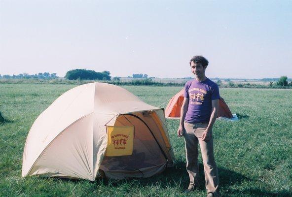 Camping area at Clark County Fairgrounds.  This is Tom, wearing Kickapoo Clogger T-shirt, sporting sideburns.