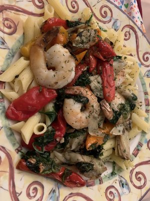 Gluten free Pasta! W shrimp, artichoke, peppers. And spinach in a garlic olive oil sauce