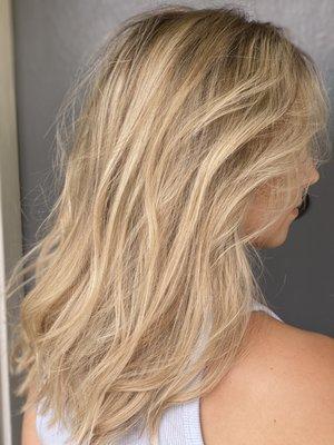 Neutral Blonde with a root-smudge.