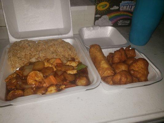 Chicken and shrimp combination with sweet and sour chicken, an egg roll and fried rice