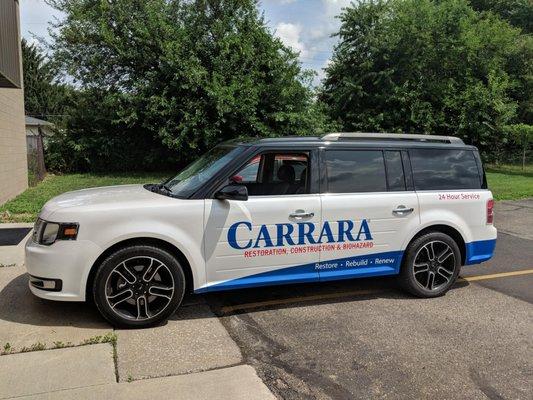 Partial wrap on a Ford Flex for Carrara! This is just one of many in their fleet that we have wrapped.