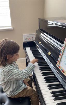 Son playing piano