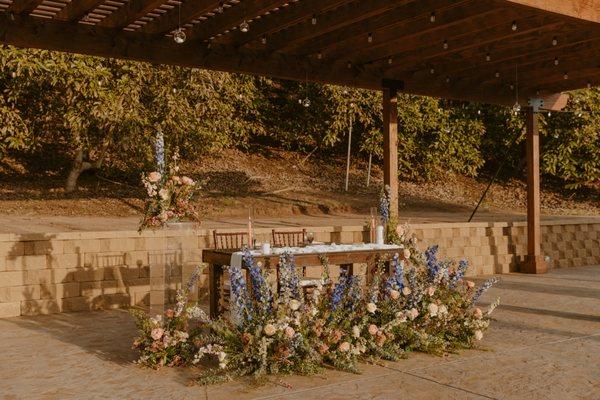 ceremony florals repurposed for reception