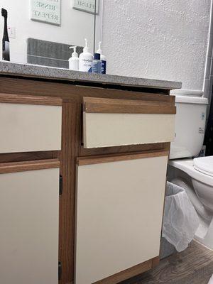 Outdated/ Lopsided restroom cabinets