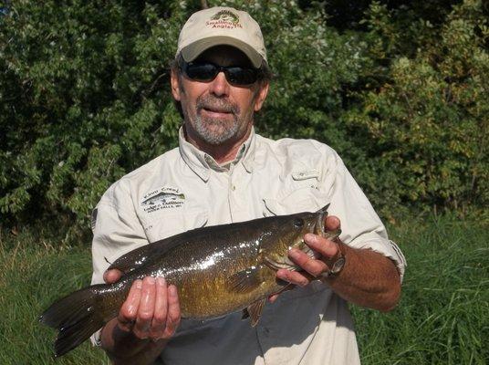 Fly fish for Smallmouth Bass with one of our guides!