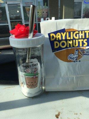 Reusable cup and a donut.