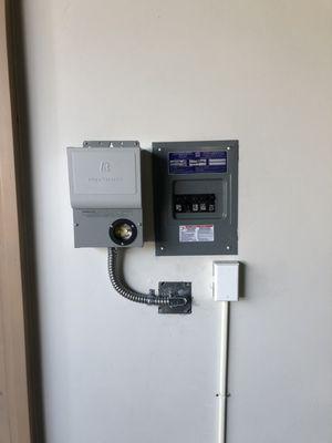 Ev inlet and transfer switch installed in a garage for a manual generator