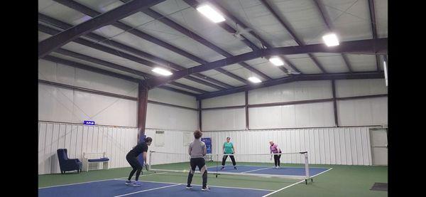 2 well lit, pro style cushioned courts with ball containment a priority along with very high ceilings for great lobs.