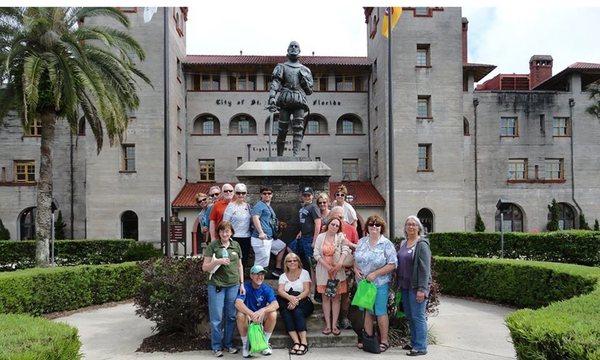 In front of the Alcazar across the street from their office.