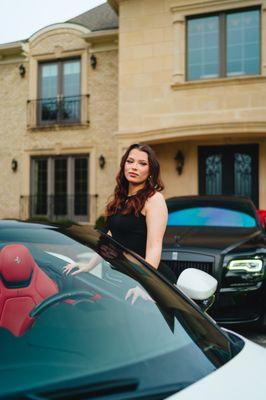 A model posing infront of our Rolls Royce Ghost and Ferrari Portofino outside of a mansion in VA.