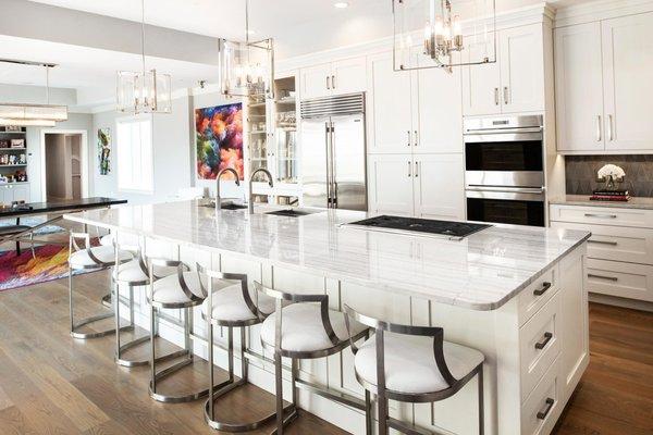 Here is a stunning contemporary Tulsa kitchen we designed & remodeled that opens up into the dining space.