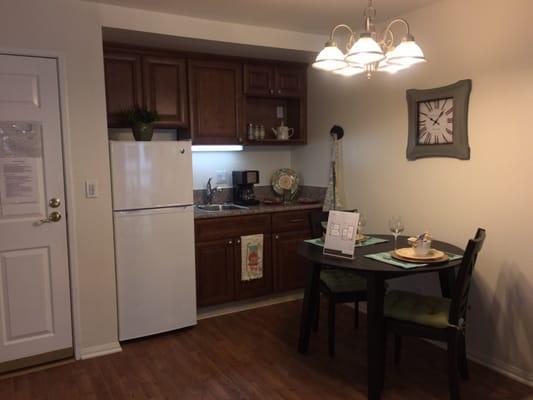 Kitchen with full sized refrigerator and cabinet space