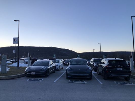 Five parking spaces for four chargers off two stations