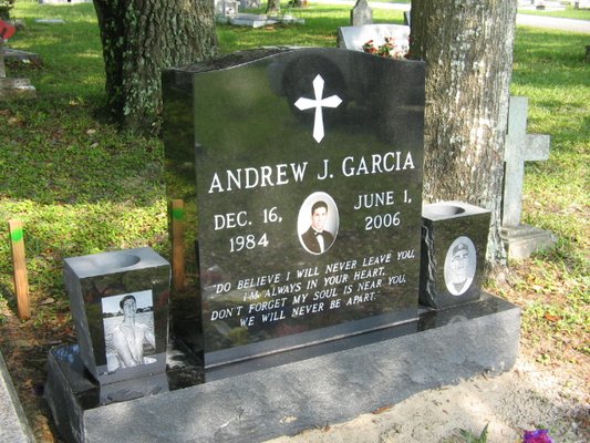 black monument with porcelain photo and lasered vases