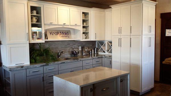 Kraftmaid white and gray shaker cabinets with quartz counter tops