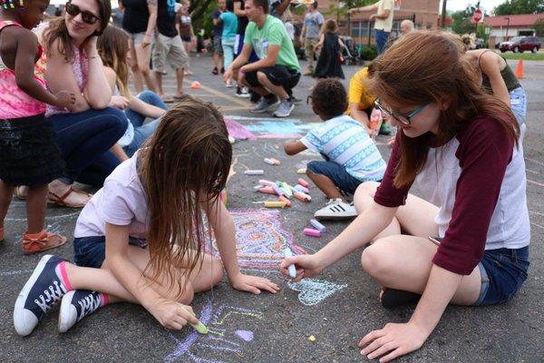 Neighbors and volunteers enjoy our monthly block parties!